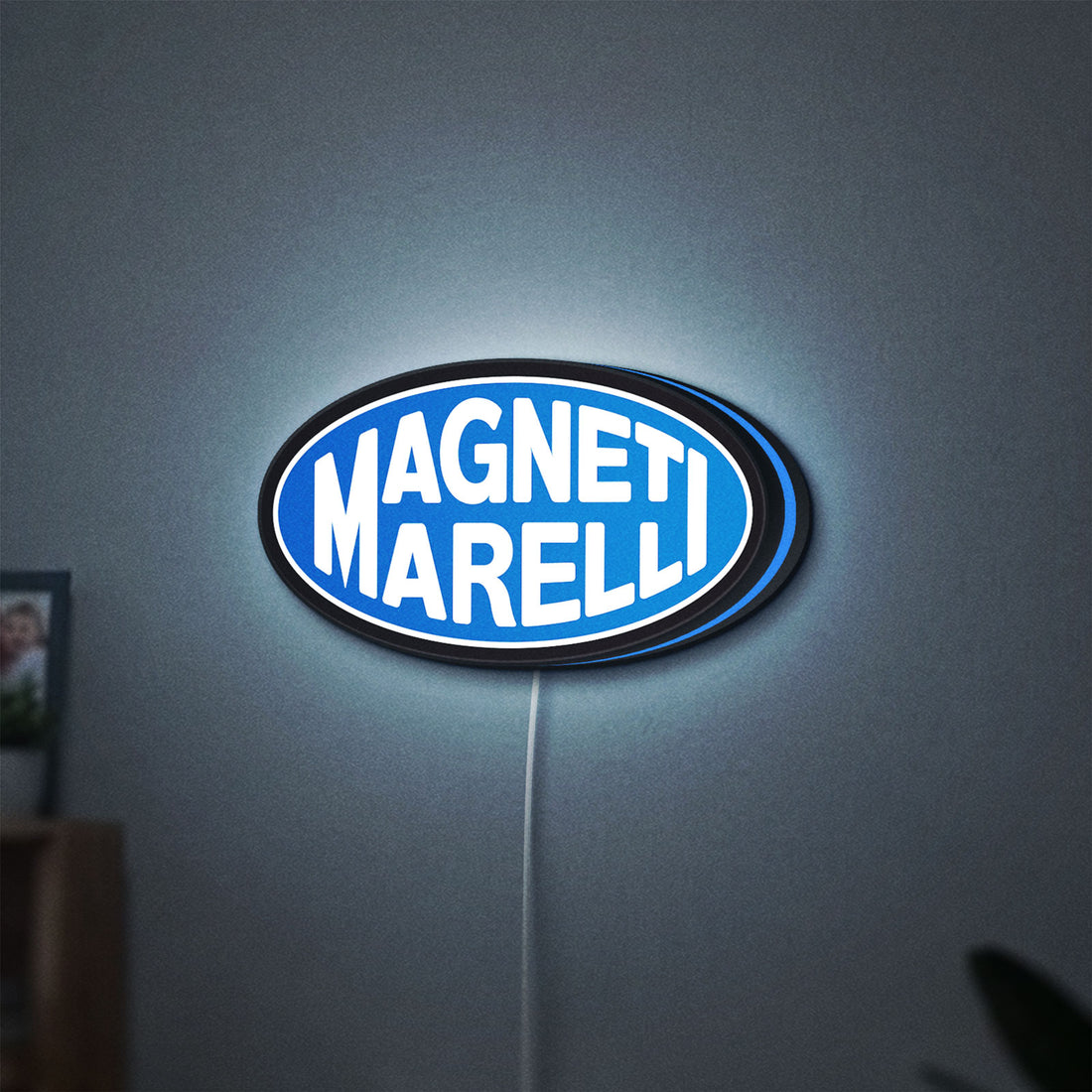 Magneti Marelli LED lightbox hanging on a wall with blue glow