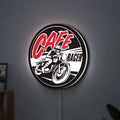 Cafe Racer LED lightbox hanging on a wall with white glow