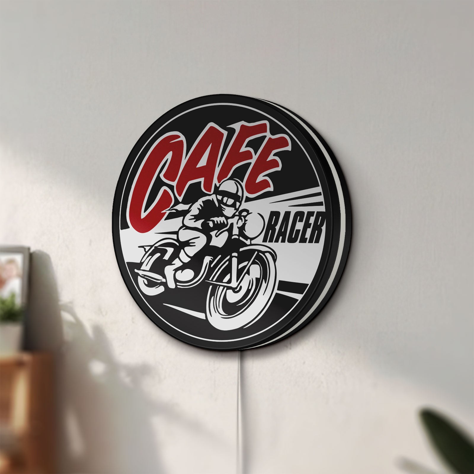 Unlit Cafe Racer LED lightbox mounted on a wall in daylight