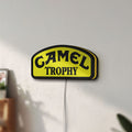 Unlit Camel Trophy LED lightbox mounted on a wall in daylight