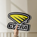 Unlit Cycra Racing LED lightbox held by hand to show size and details