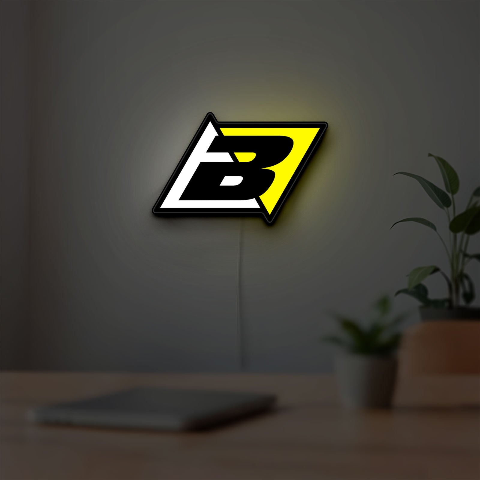 Blackbird Racing LED lightbox hanging on a room wall with soft yellow light