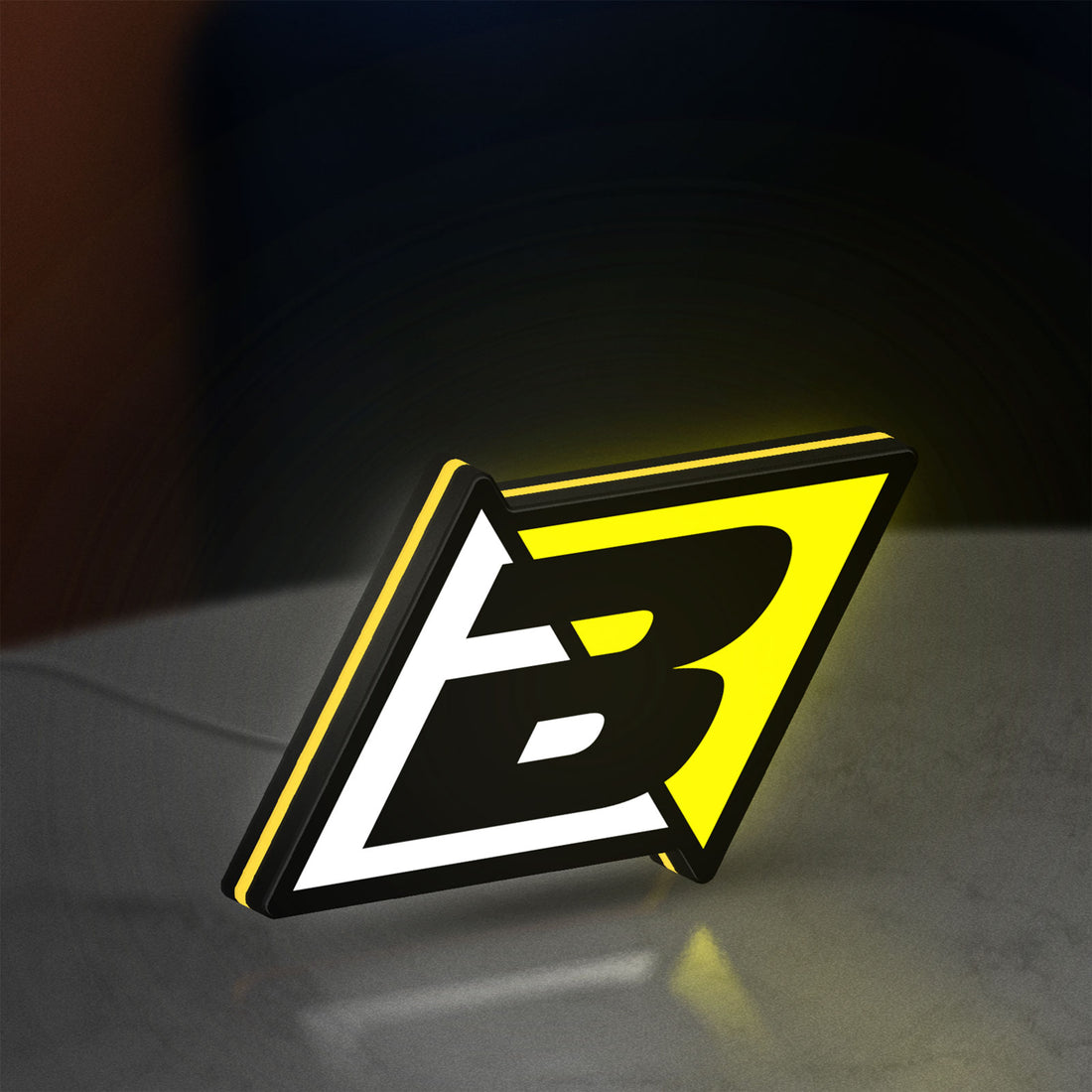 Blackbird Racing LED lightbox hanging on a wall with yellow glow