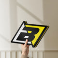 Unlit Blackbird Racing LED lightbox held by hand to show size and details
