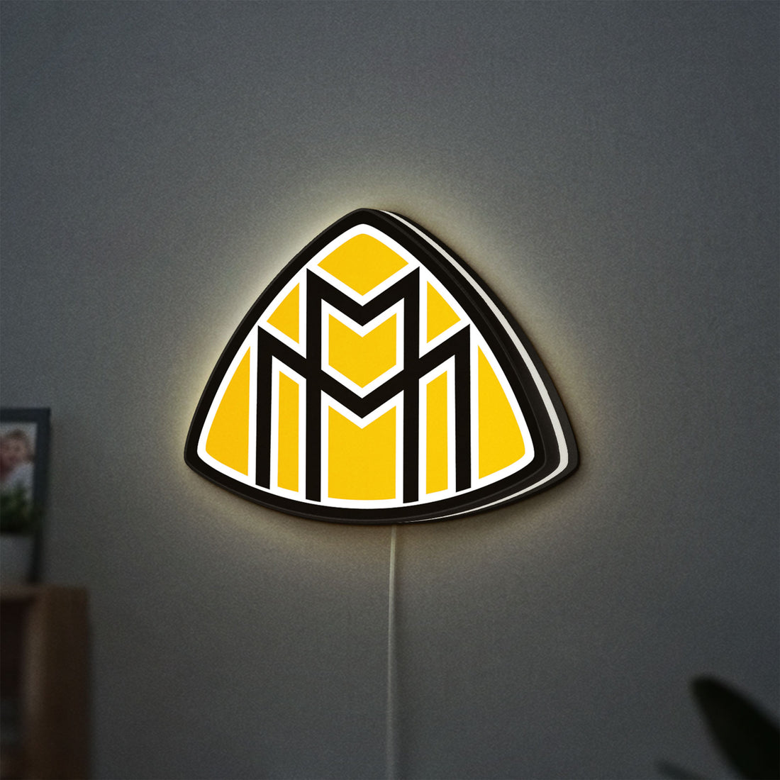 Maybach LED lightbox hanging on a wall with white glow