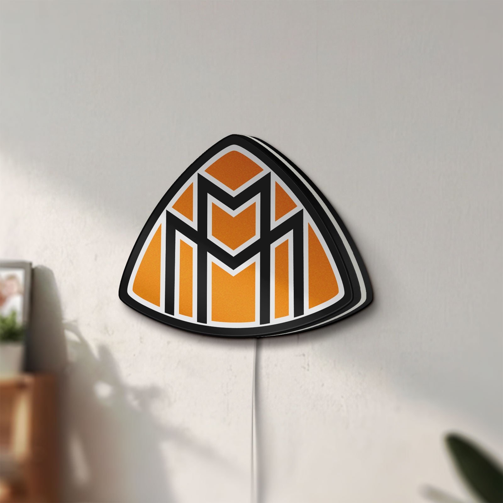 Unlit Maybach LED lightbox mounted on a wall in daylight