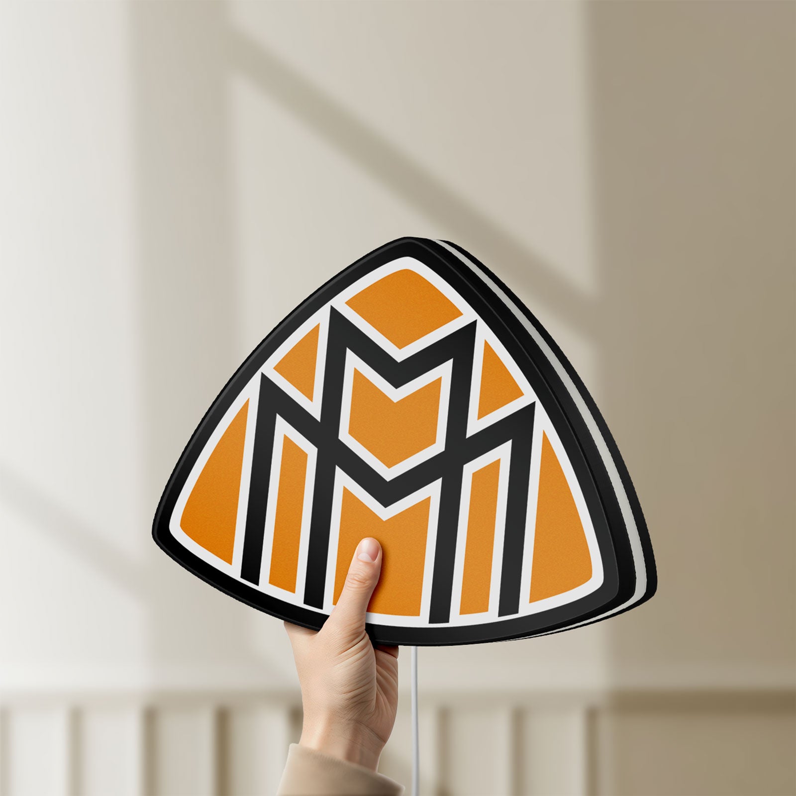 Unlit Maybach LED lightbox held by hand to show size and details