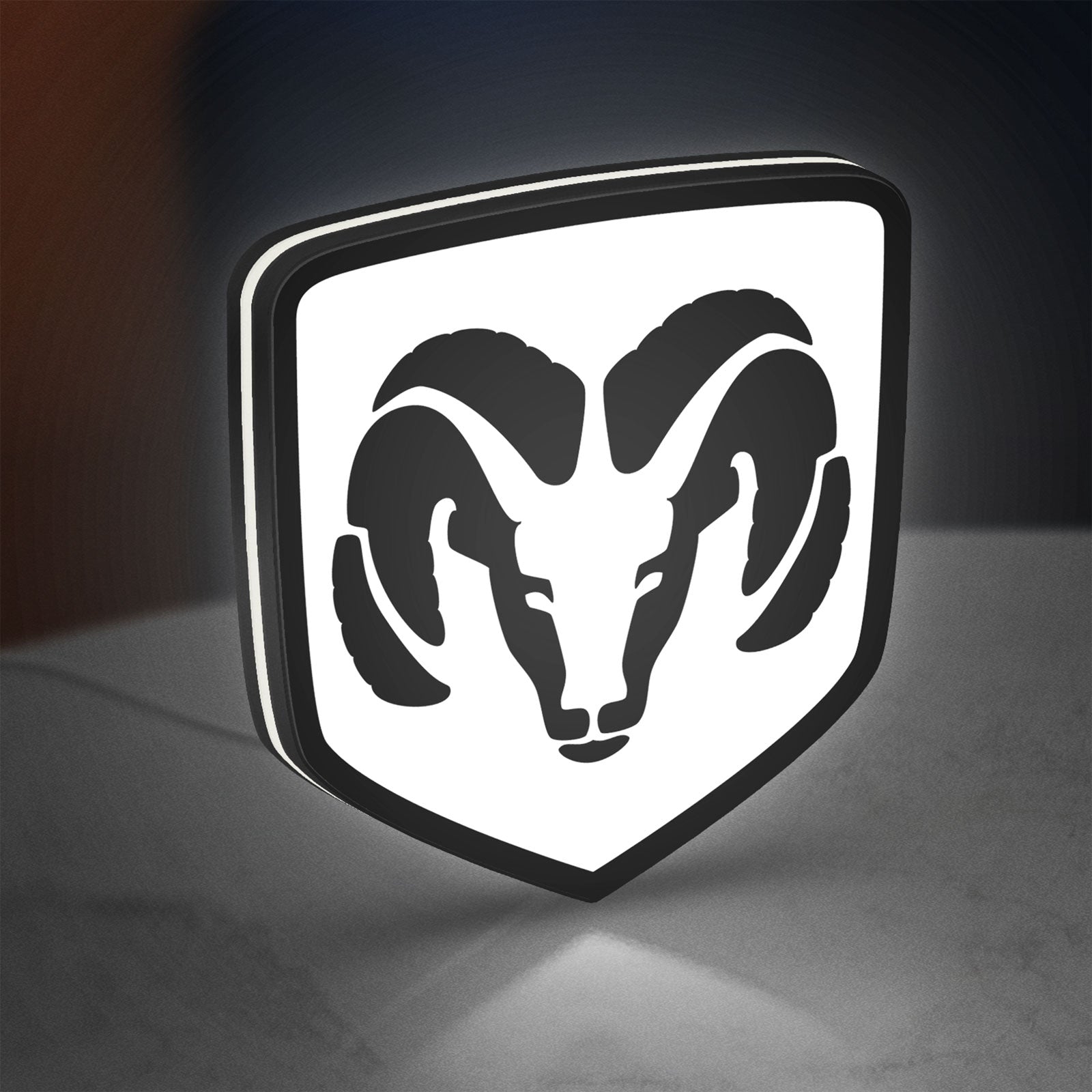 DODGE RAM LED lightbox standing on a desk from an angled side view with white glow