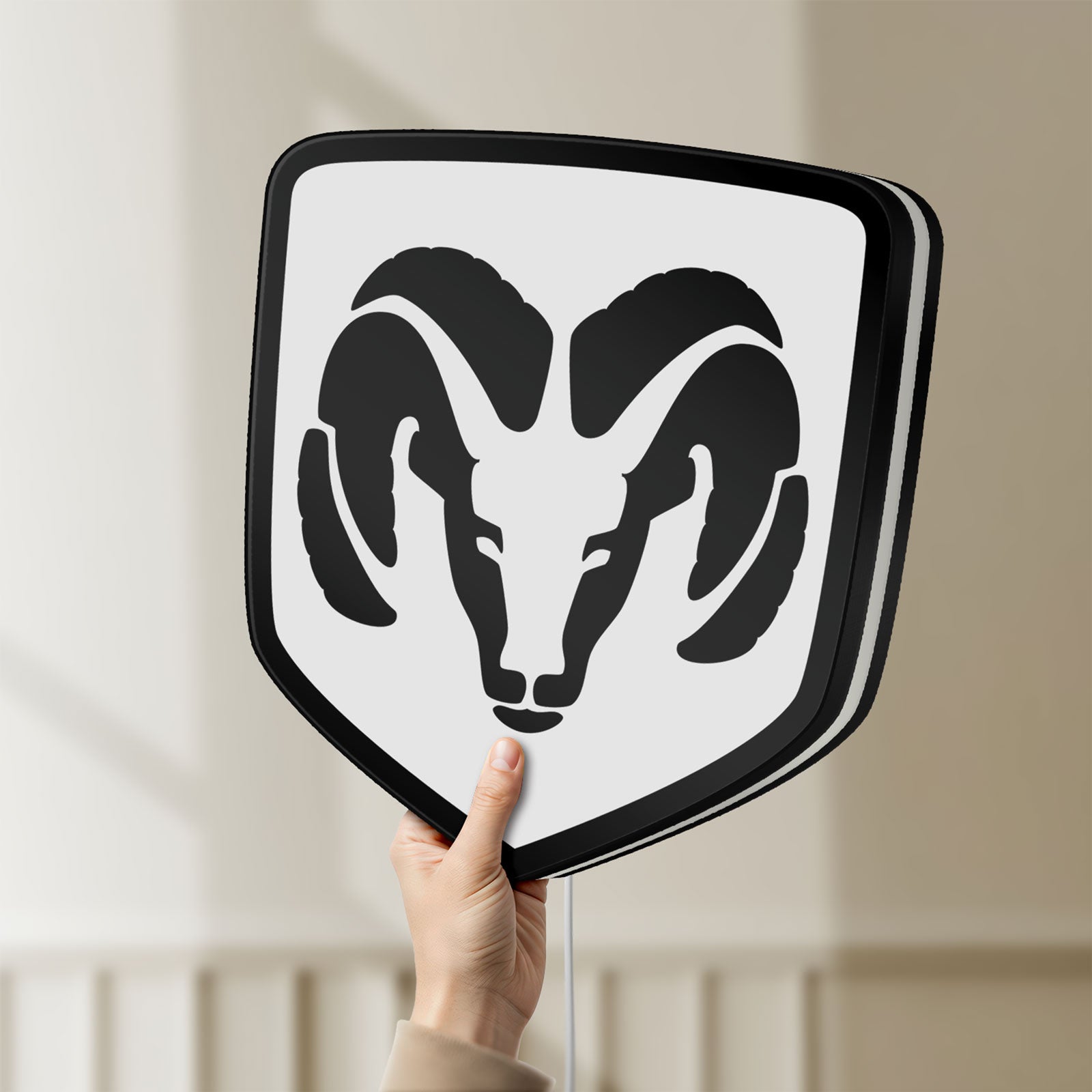 Unlit DODGE RAM LED lightbox held by hand to show size and details