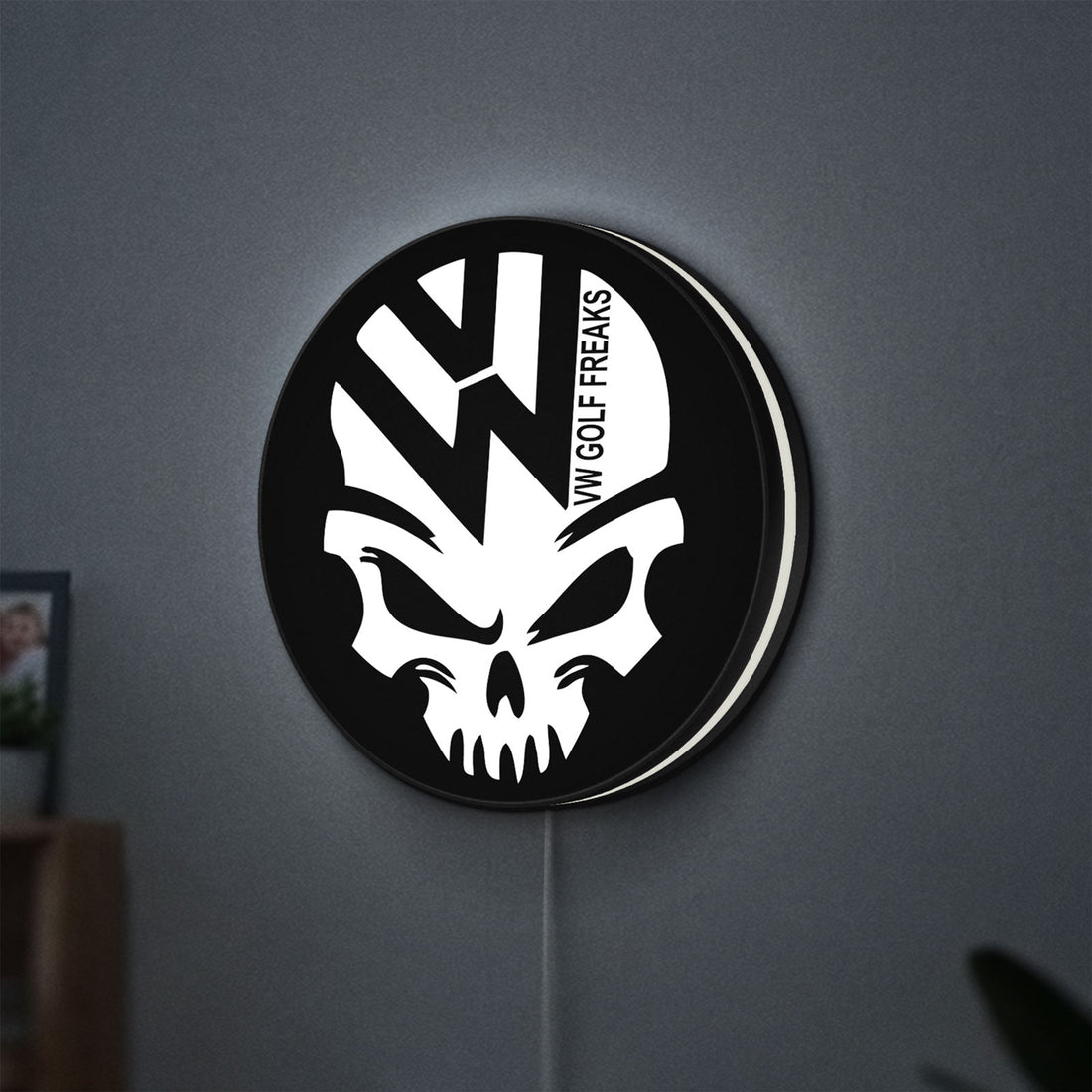 VW Volkswagen Skull LED lightbox hanging on a wall with white glow