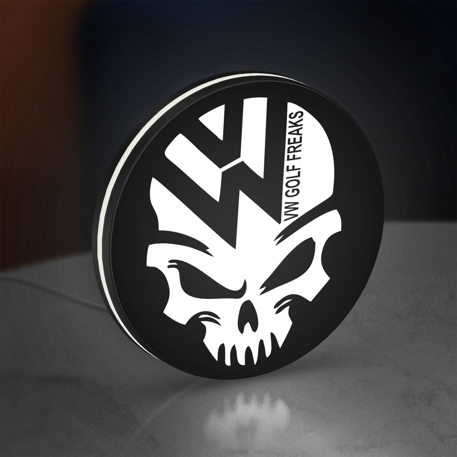 VW Volkswagen Skull LED lightbox standing on a desk from an angled side view with white glow