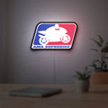 AMA Superbike LED lightbox hanging on a room wall with soft white light