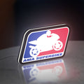 AMA Superbike LED lightbox standing on a desk from an angled side view with white glow