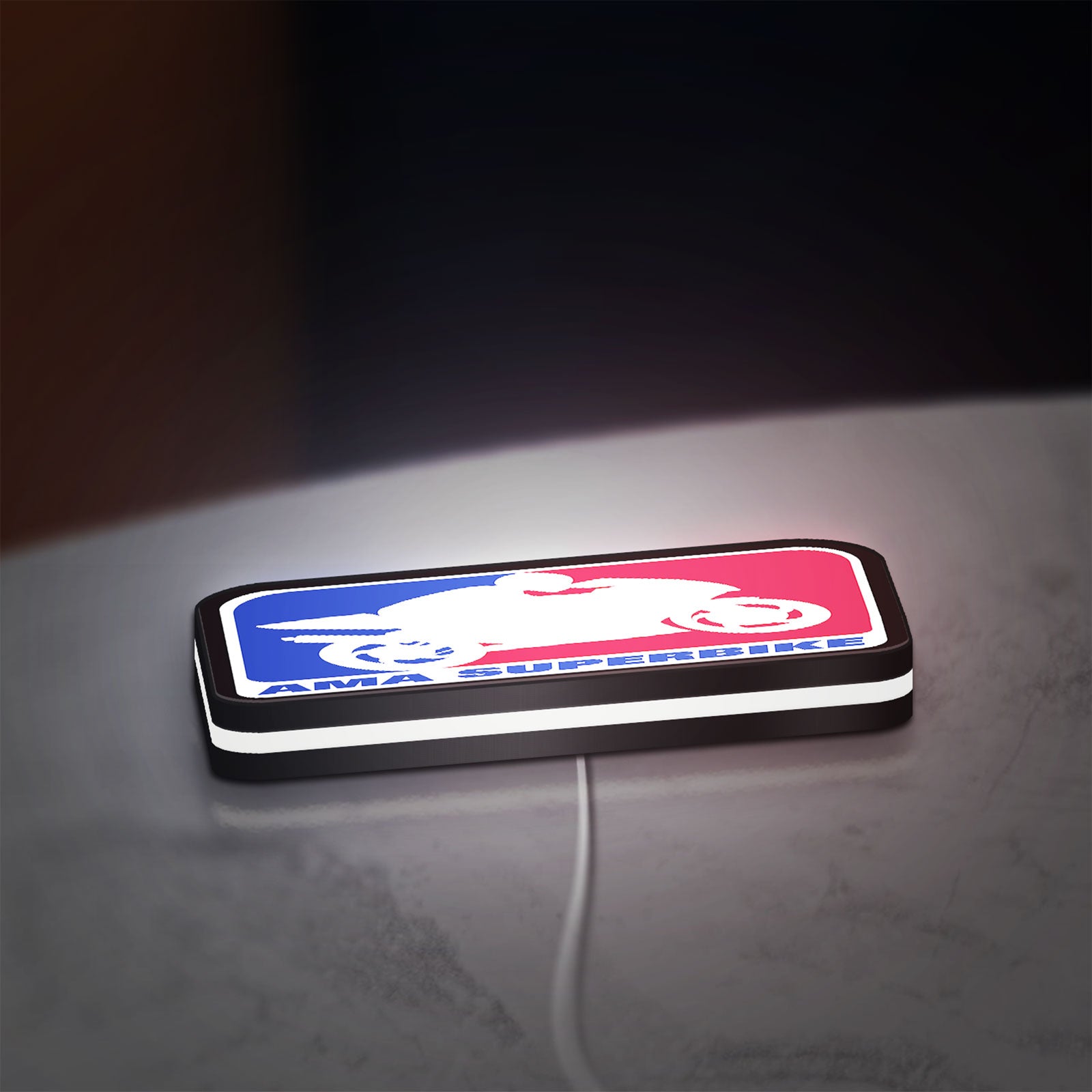AMA Superbike LED lightbox lying flat on a desk with white glow