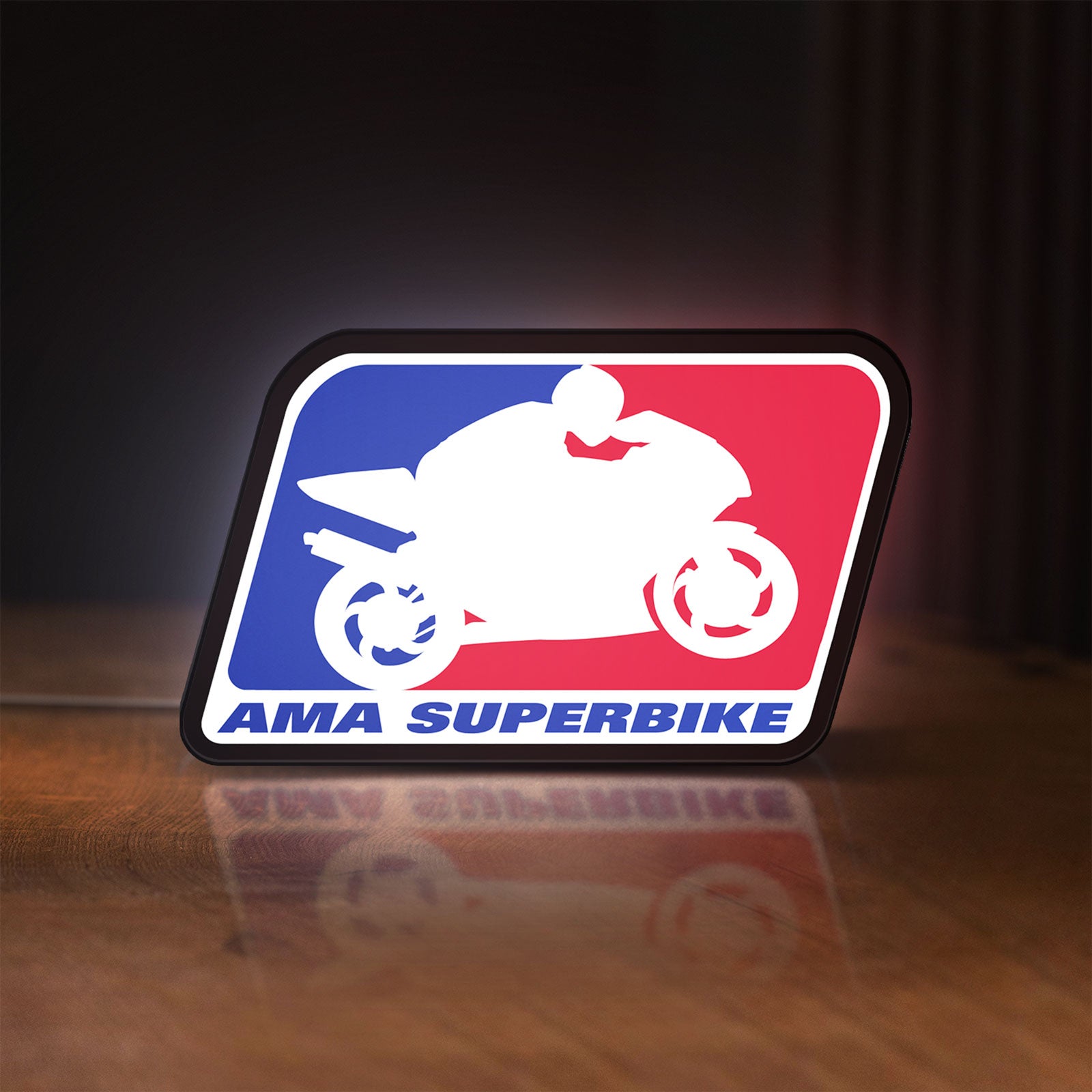 Front view of AMA Superbike LED lightbox sign glowing on a wooden desk
