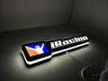 Illuminated flat lay angled view of Iracing 3D LED Sign in 30cm, perfect for garage and man cave decor