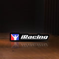 Front view of iRacing LED lightbox sign glowing on a wooden desk