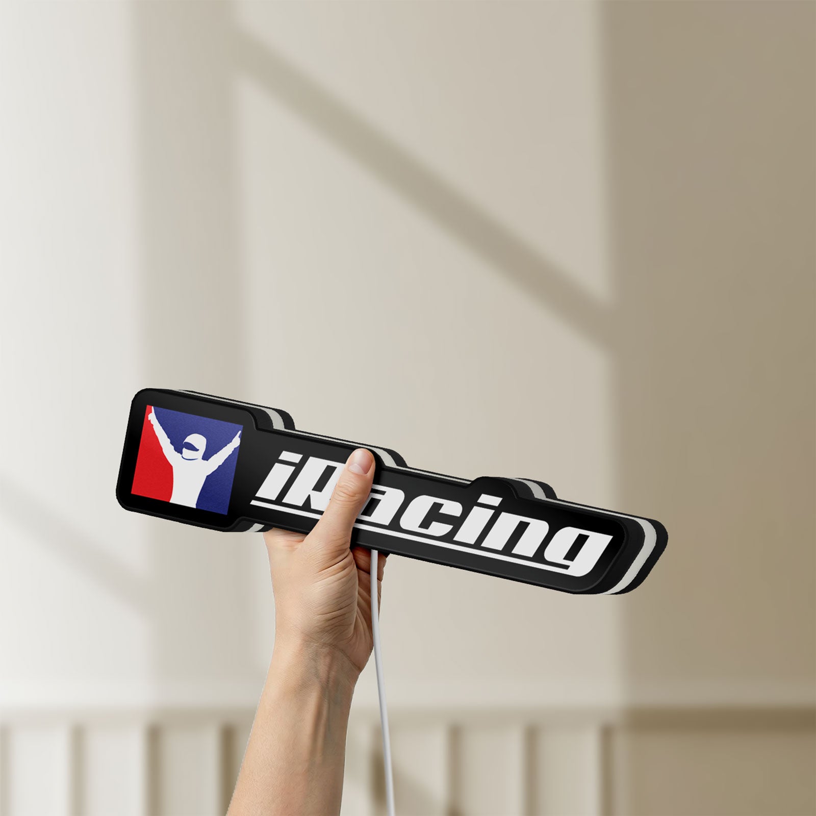 Unlit iRacing LED lightbox held by hand to show size and details