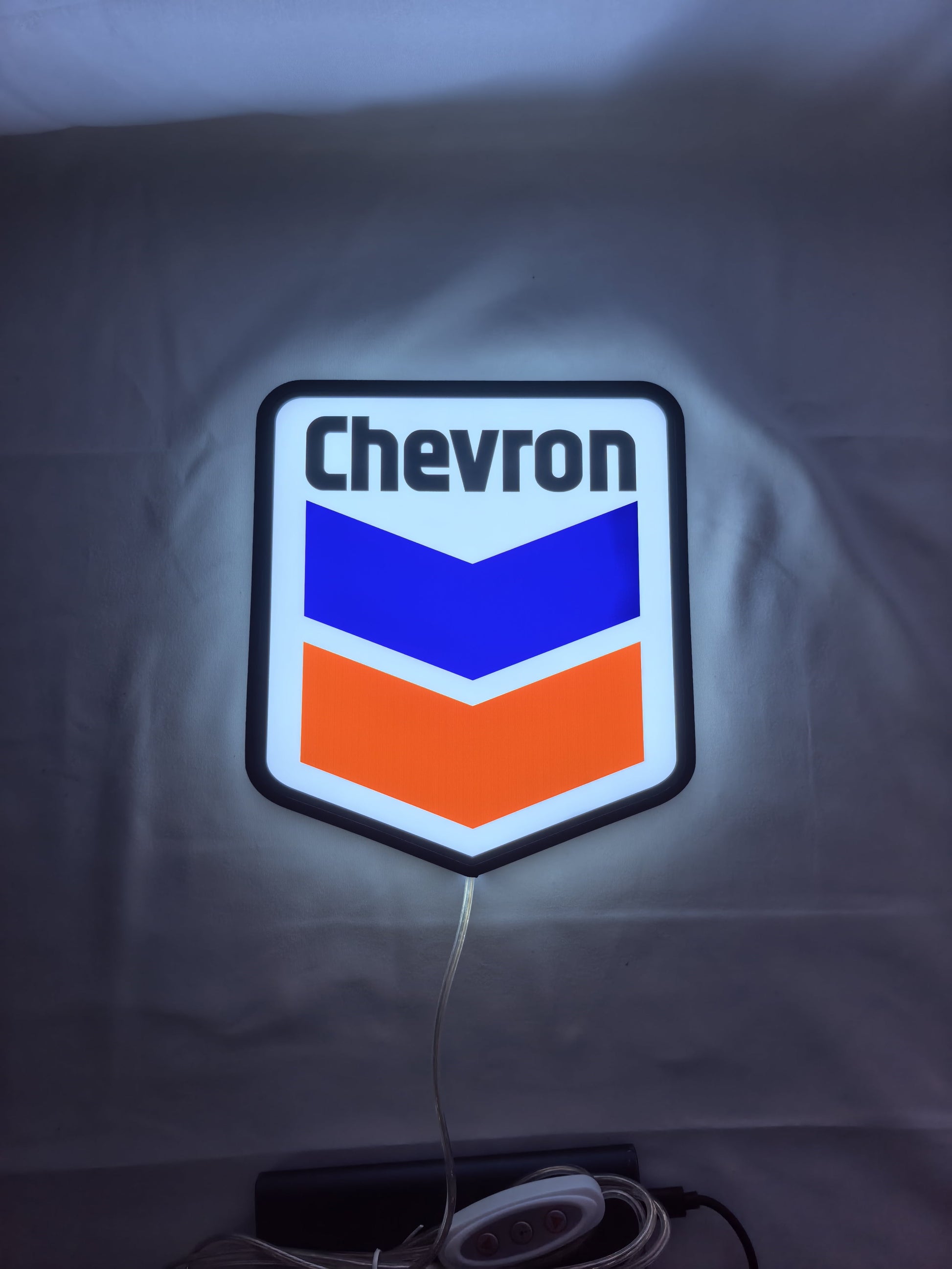 Chevron LED Sign (20cm) - Illuminated flat lay front view, unique wall art for desk and room decor