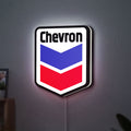 Chevron LED lightbox hanging on a wall with white glow