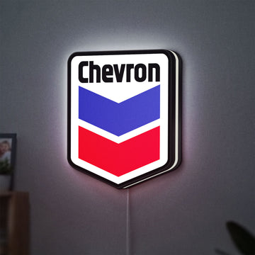 Chevron LED lightbox hanging on a wall with white glow