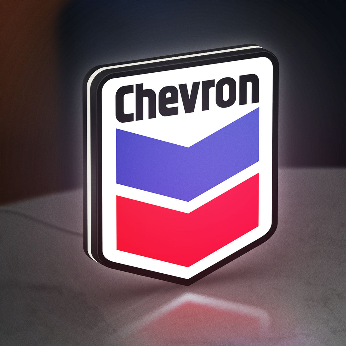Chevron LED lightbox hanging on a wall with white glow