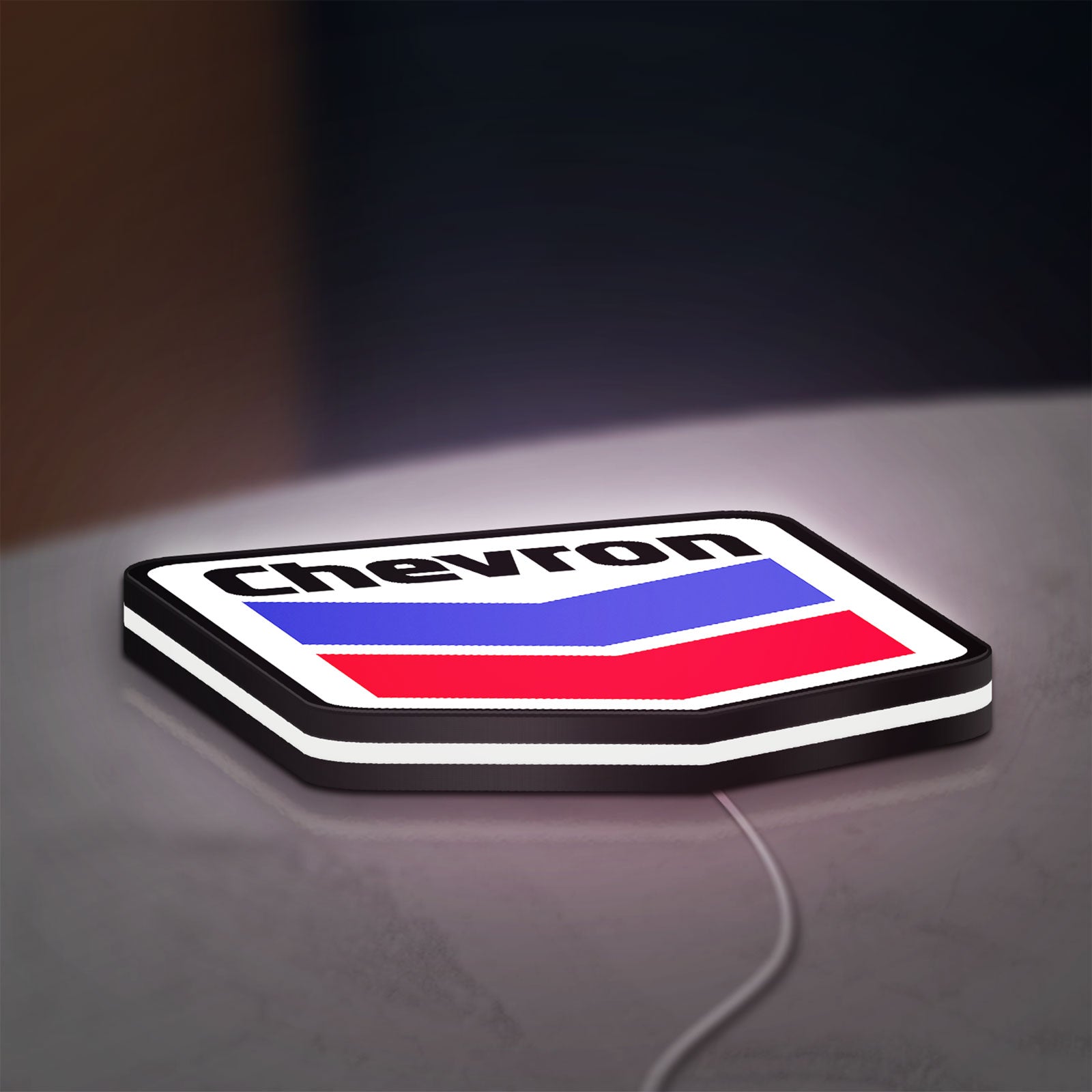 Chevron LED lightbox lying flat on a desk with white glow