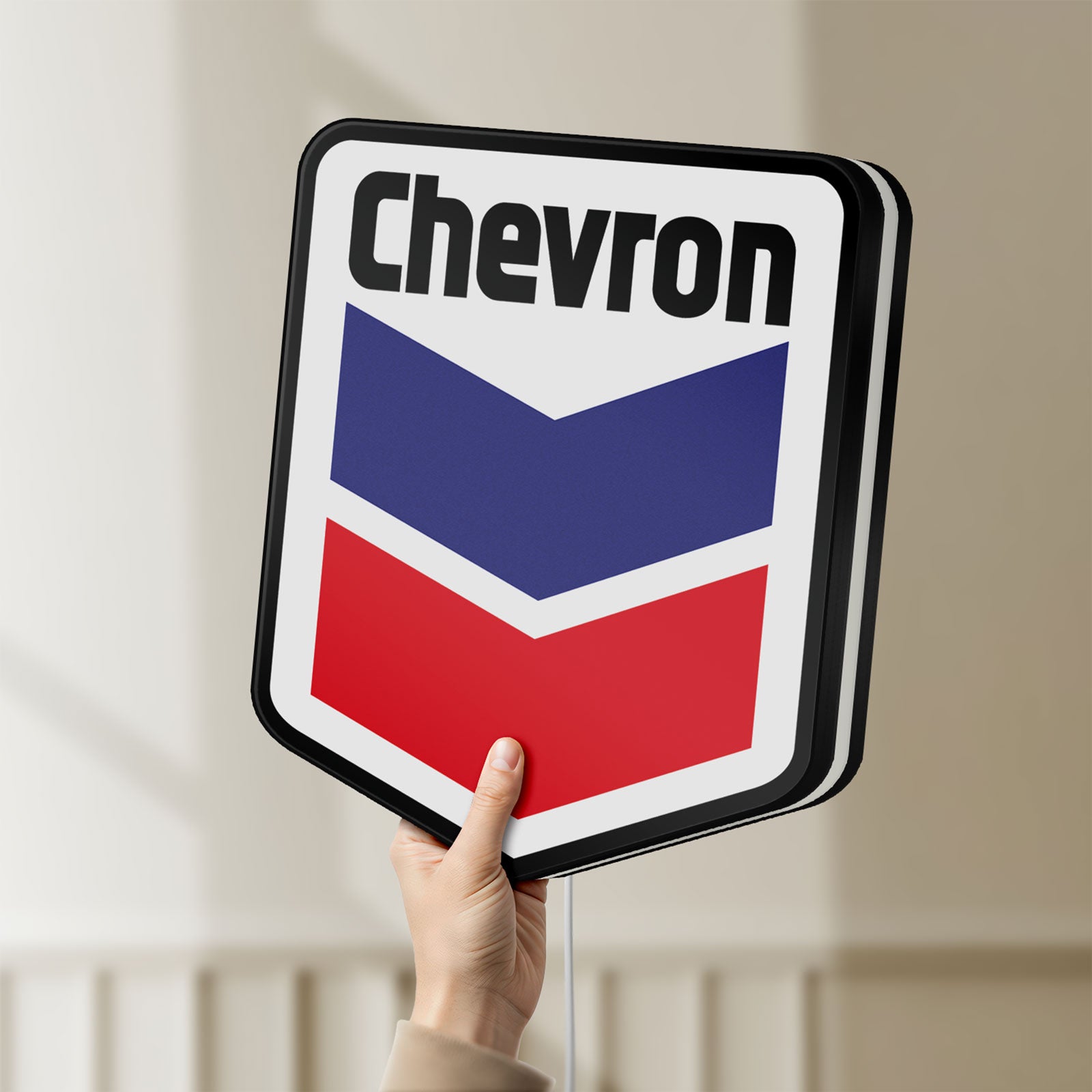 Unlit Chevron LED lightbox held by hand to show size and details