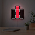 International Harvester LED lightbox hanging on a room wall with soft white light
