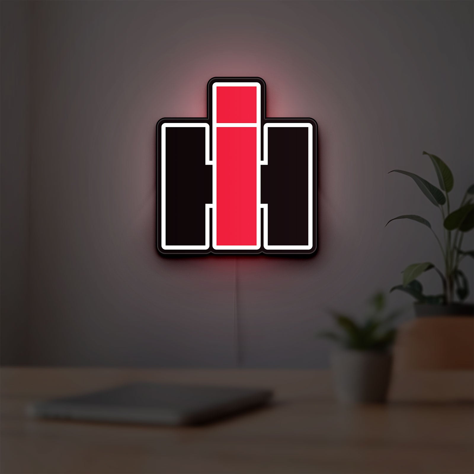International Harvester LED lightbox hanging on a room wall with soft white light