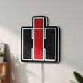 Unlit International Harvester LED lightbox mounted on a wall in daylight