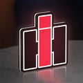 International Harvester LED lightbox standing on a desk from an angled side view with white glow