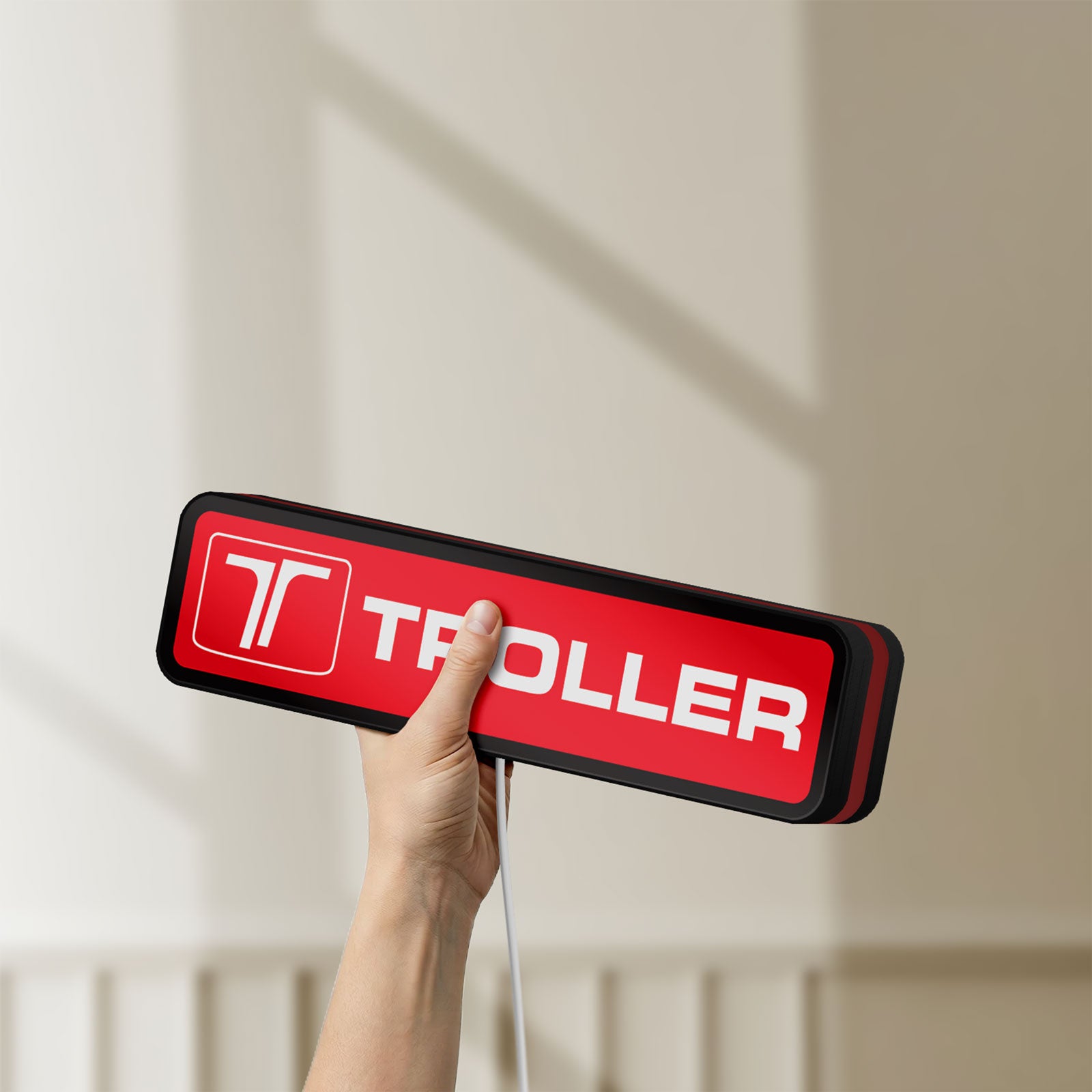 Unlit Troller LED lightbox held by hand to show size and details