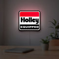 Holley Equipped LED lightbox hanging on a room wall with soft white light