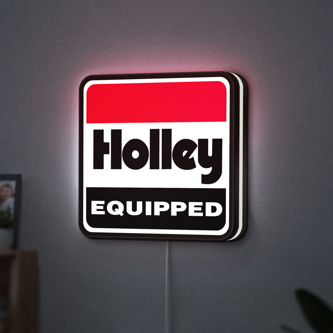 Holley Equipped LED lightbox hanging on a wall with white glow