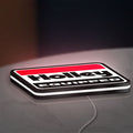Holley Equipped LED lightbox lying flat on a desk with white glow