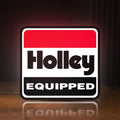 Front view of Holley Equipped LED lightbox sign glowing on a wooden desk