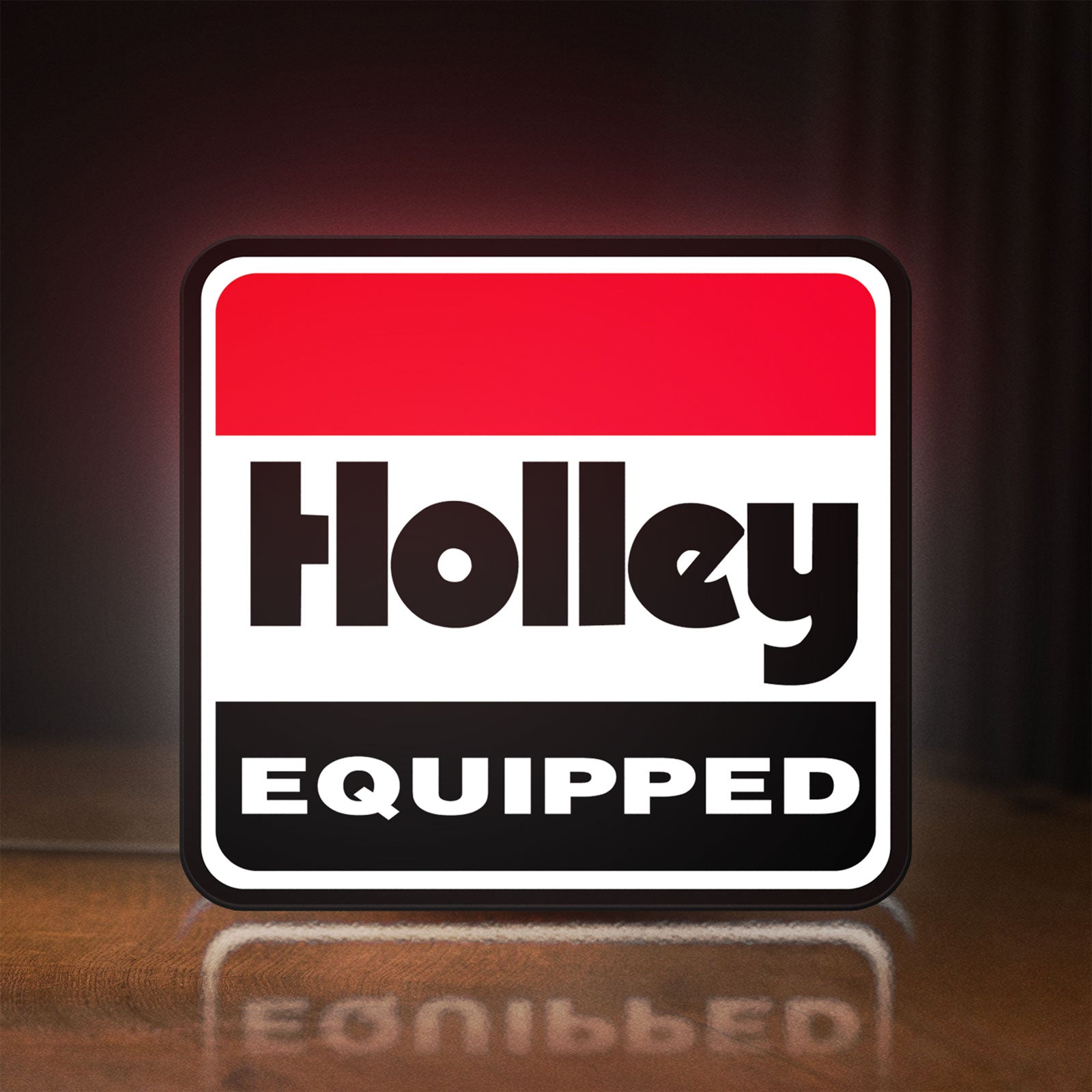 Front view of Holley Equipped LED lightbox sign glowing on a wooden desk