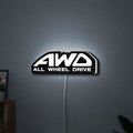 AWD LED lightbox hanging on a wall with white glow