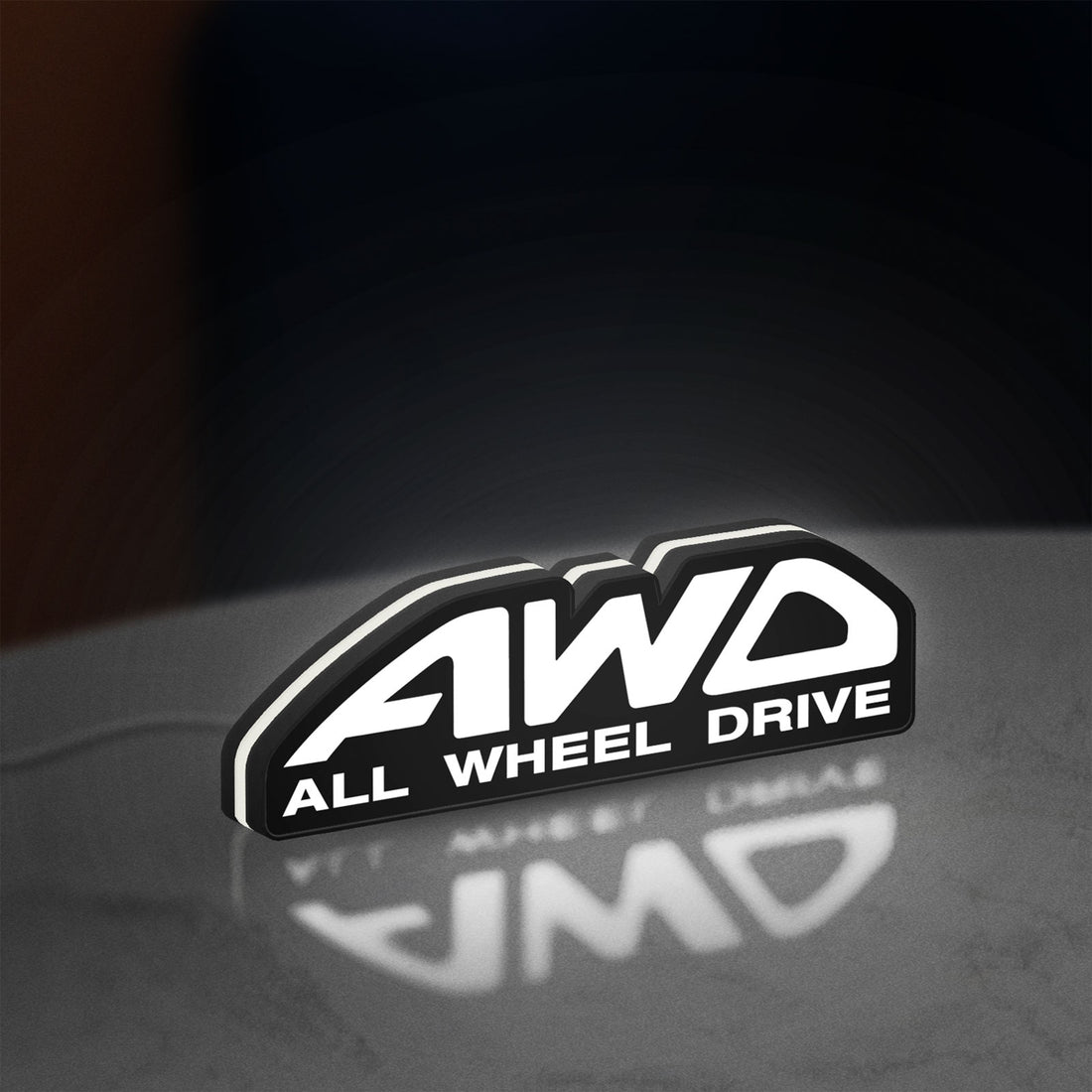 AWD LED lightbox hanging on a wall with white glow