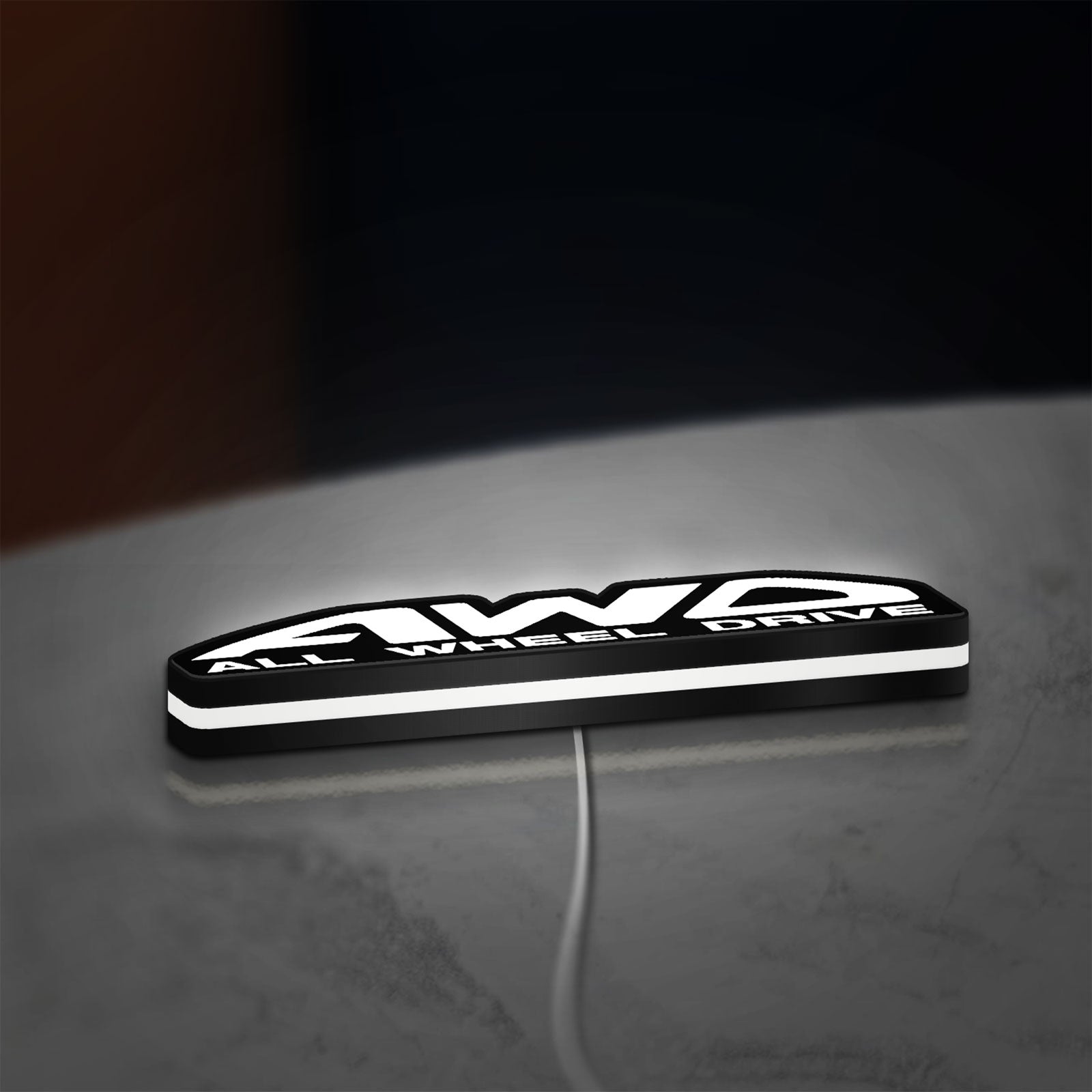 AWD LED lightbox lying flat on a desk with white glow