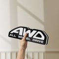 Unlit AWD LED lightbox held by hand to show size and details