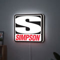 Simpson Racing LED lightbox hanging on a wall with white glow