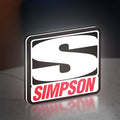Simpson Racing LED lightbox standing on a desk from an angled side view with white glow