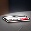 Simpson Racing LED lightbox lying flat on a desk with white glow