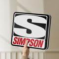 Unlit Simpson Racing LED lightbox held by hand to show size and details