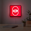 Gilera LED lightbox hanging on a room wall with soft red light