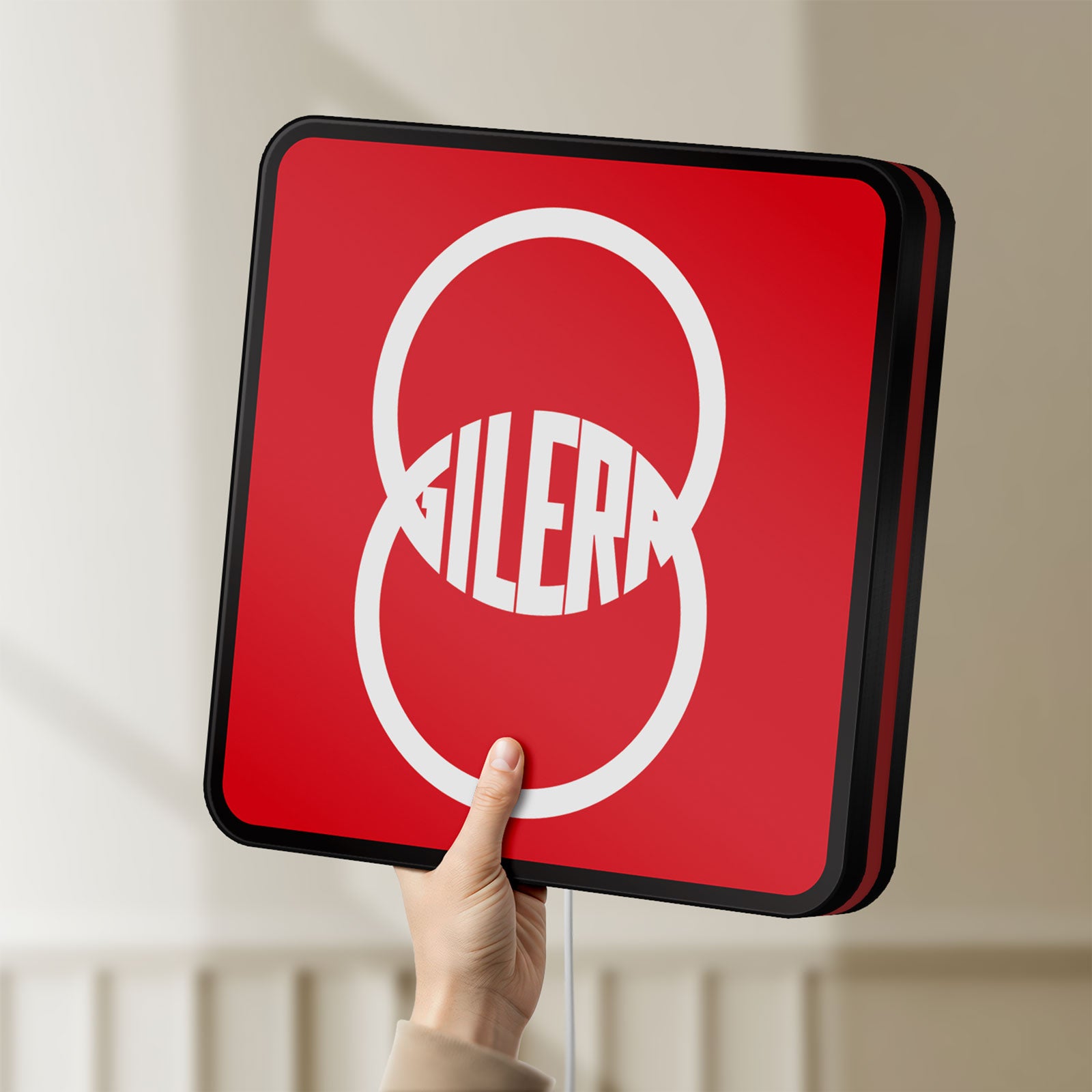 Unlit Gilera LED lightbox held by hand to show size and details