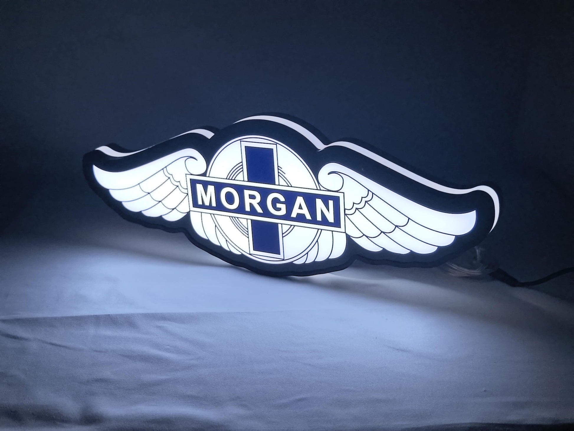 Illuminated angled view standing of Morgan Motors Illuminated Sign in 30cm, unique wall art for desk and room decor
