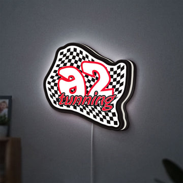 A2 Tuning LED lightbox hanging on a wall with white glow